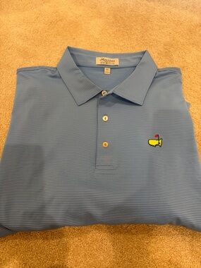 Masters Men’s Light Blue Performance Polo with Yellow Green Logo